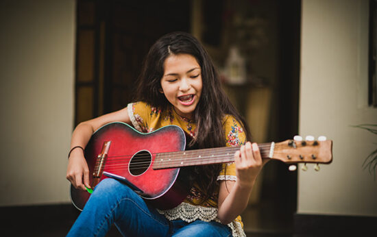 teen-girl-playing-guitar-2021-08-31-21-57-39-utc