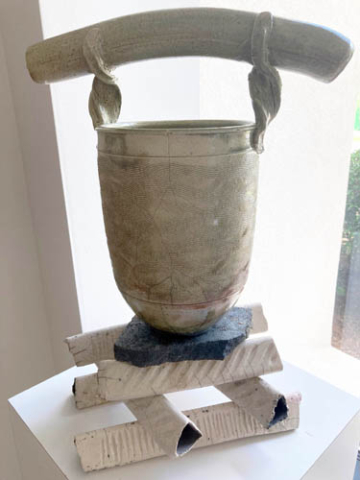 Raku, clay, light colored vessel