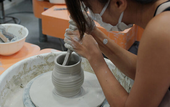 woman-make-pottery-wheel-shaping-a-clay-pot-CeramicRotation