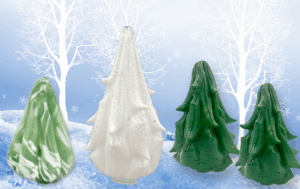 various glass Christmas trees on a winter backdrop