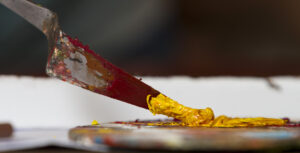 palette knife mixing gold oil or acrylic paint