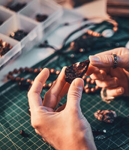hands making jewelry